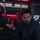 The crew of the Rocinante looks intensely at something in a scene from The Expanse.